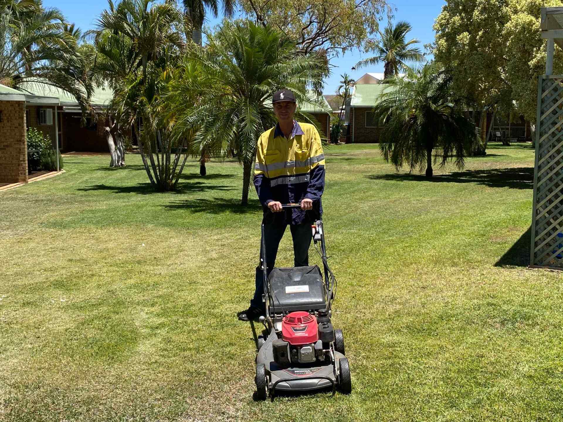 Man Mowing Garden — Gallery in Mount Isa, QLD