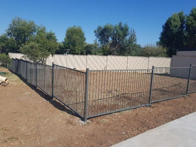 A Wooden Fence Created In A Backyard To Enclosed The Area — Anne & Ron Johnson Fencing in Werris Creek, NSW