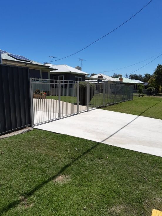 A Driveway Leading To A Gate, Surrounded By A Fence On Both Sides — Anne & Ron Johnson Fencing in Werris Creek, NSW