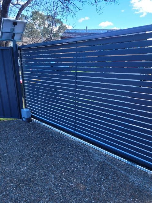 An Automatic Gate Featuring A Solar Panel — Anne & Ron Johnson Fencing in Werris Creek, NSW