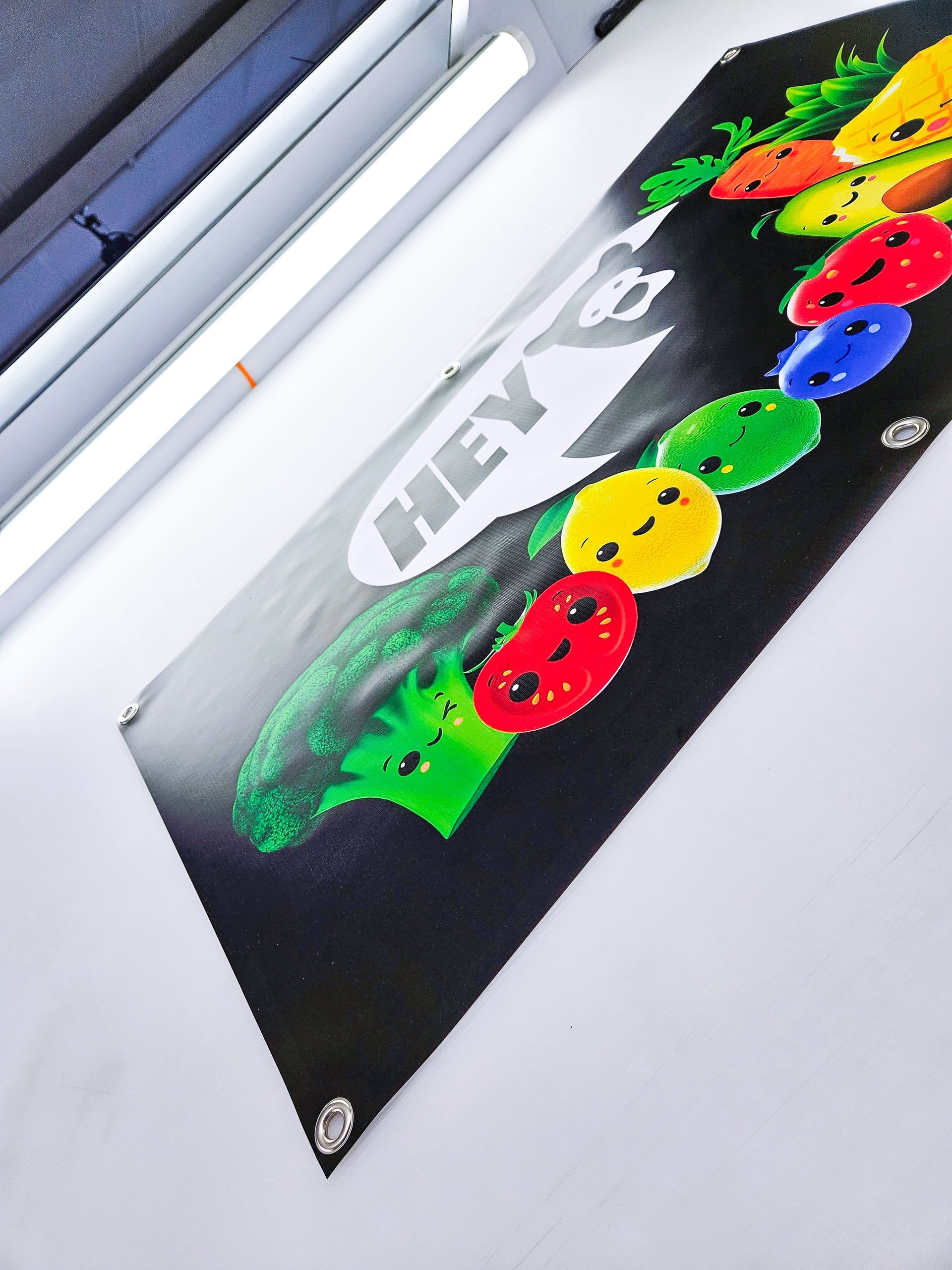 A black banner with a picture of fruits and vegetables on it.