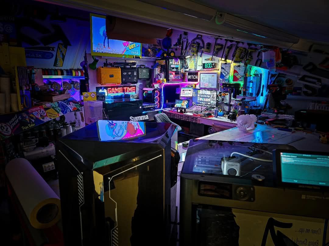 A room filled with lots of electronics and a table.