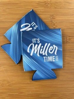 Blue Miller Lite shirts reading “It’s Miller Time” laid out flat