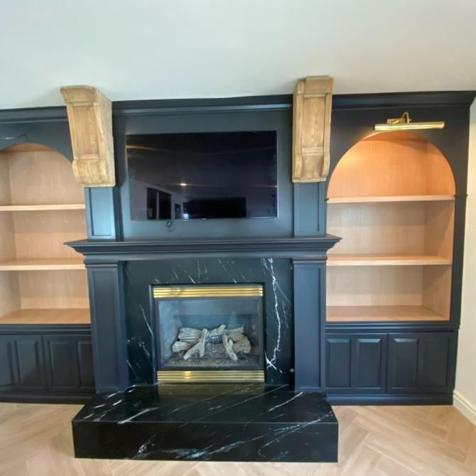 A fireplace with a flat screen tv above it