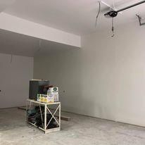 There is a table in the middle of the room.