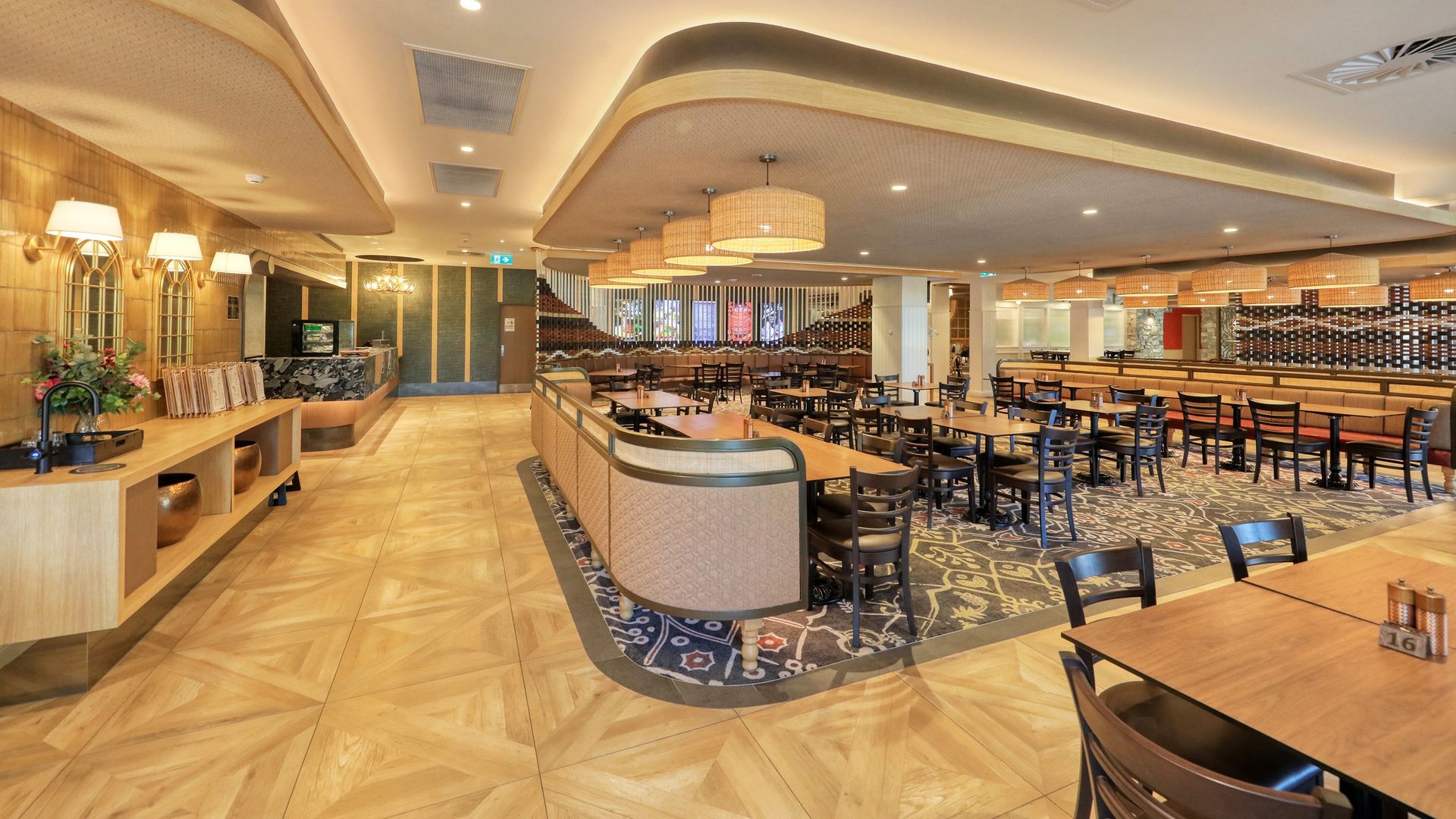 A hamburger and french fries on a white plate on a table.