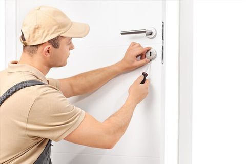 Man Repairing Door Lock — Home Lockout Service in Boswell, PA