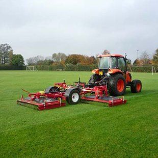 tractor with grounds maintenance linked