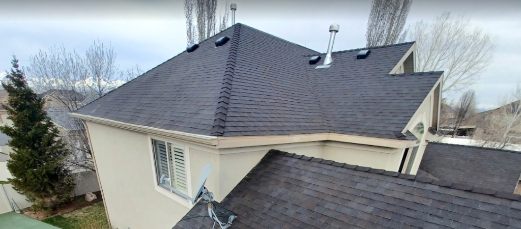 An aerial view of a house with a new roof.