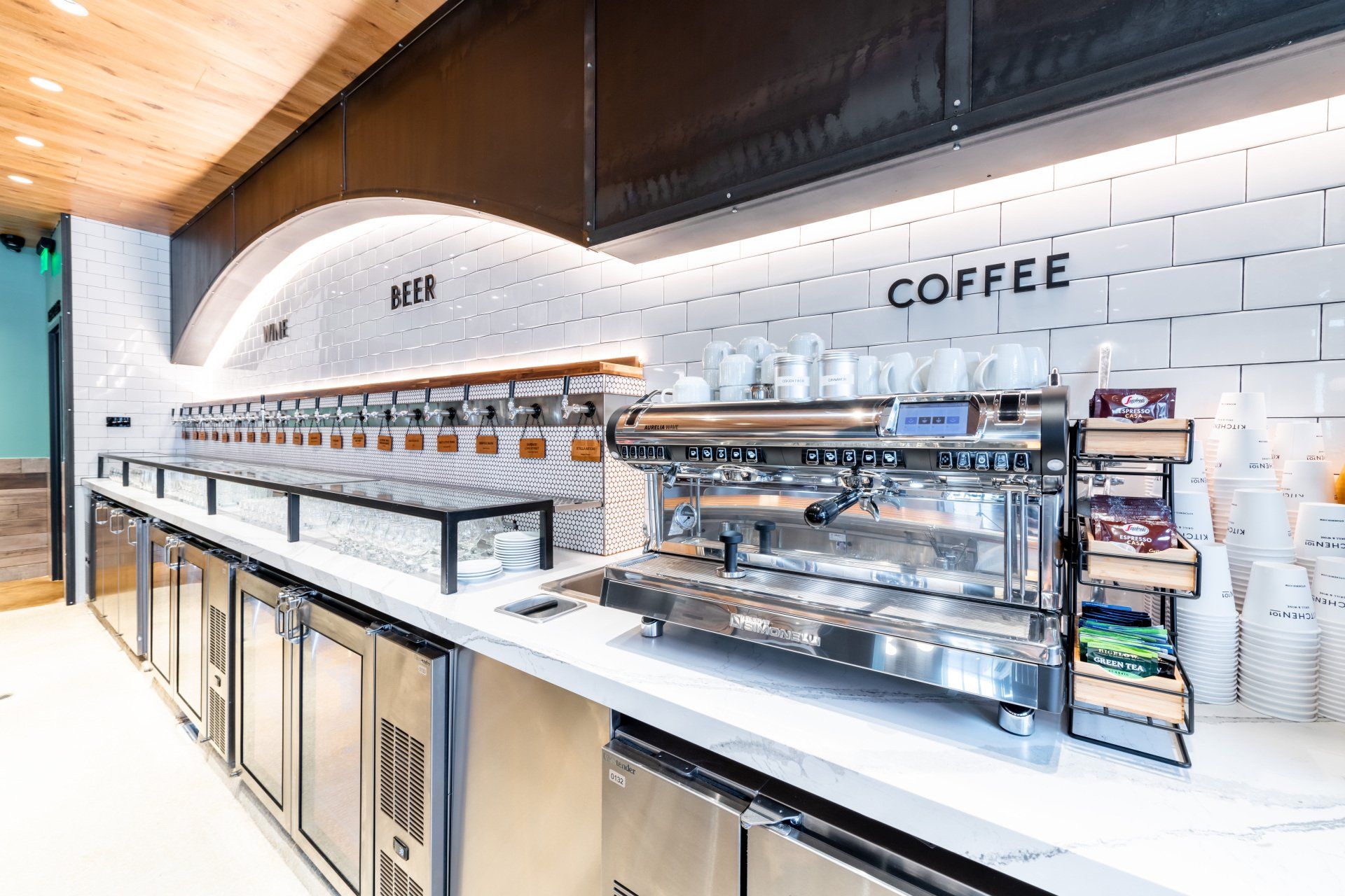 A coffee machine is sitting on a counter in a restaurant.