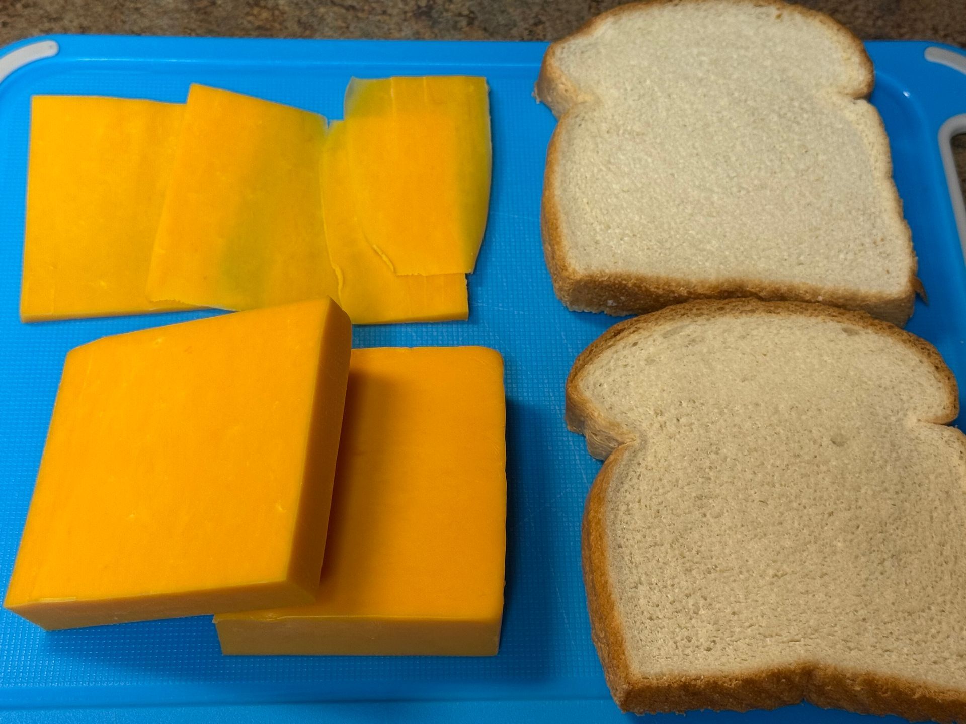 A pot filled with rice and greens is being cooked
