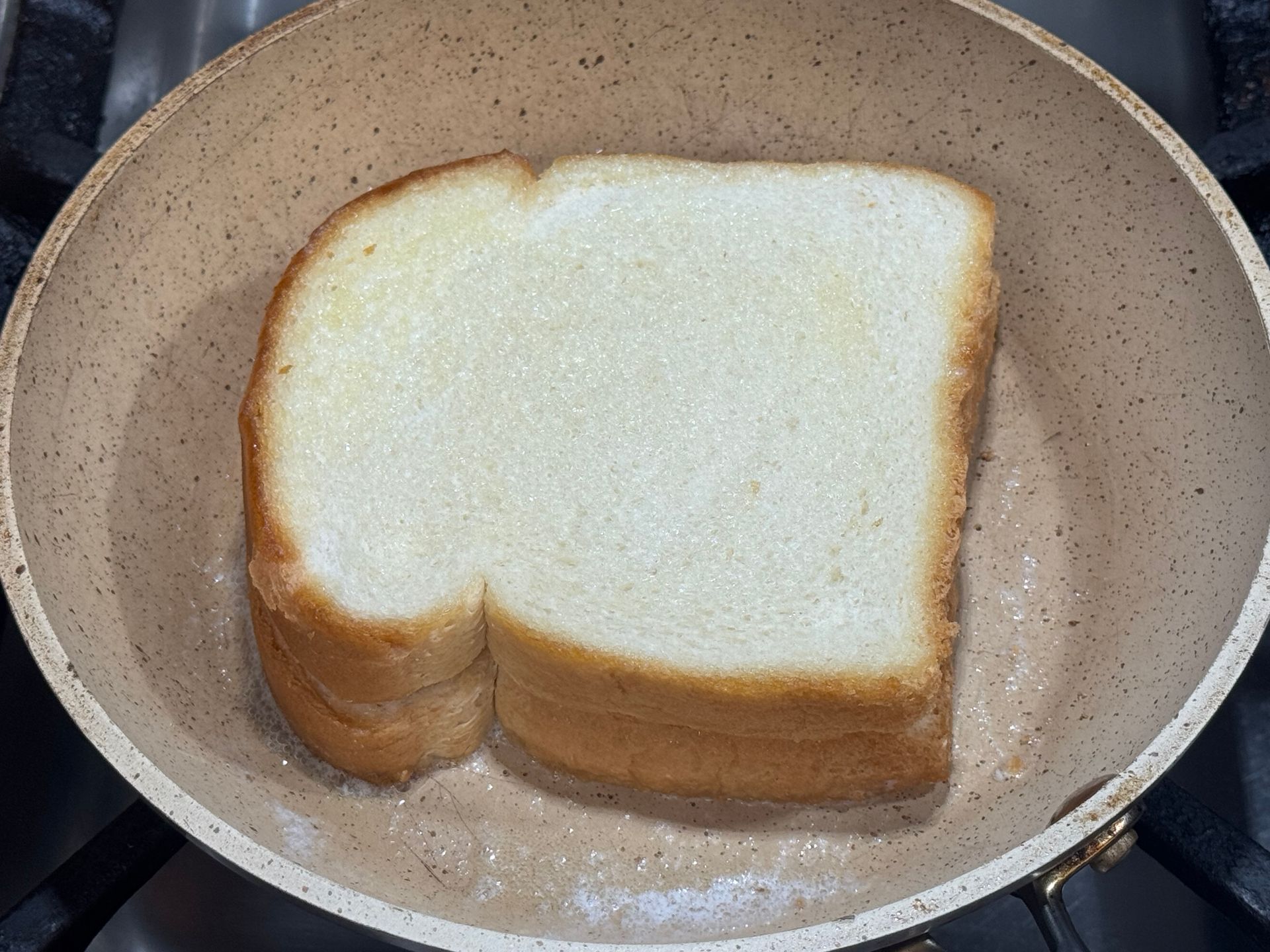 A tortilla with meat rice and cheese on it