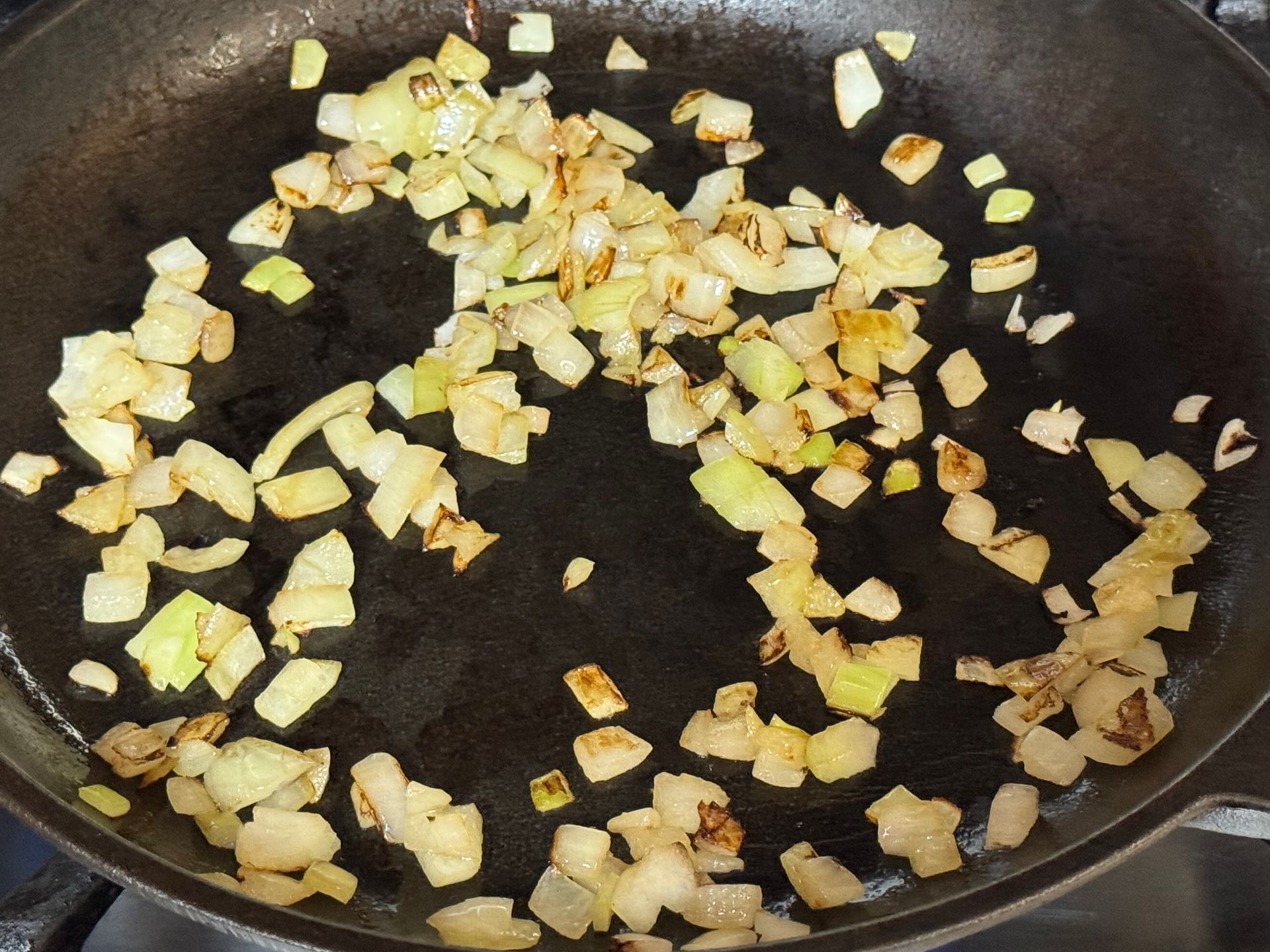 A tortilla with meat rice and cheese on it