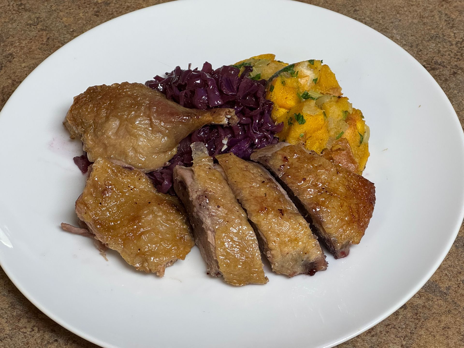 A white bowl filled with stuffing and green onions