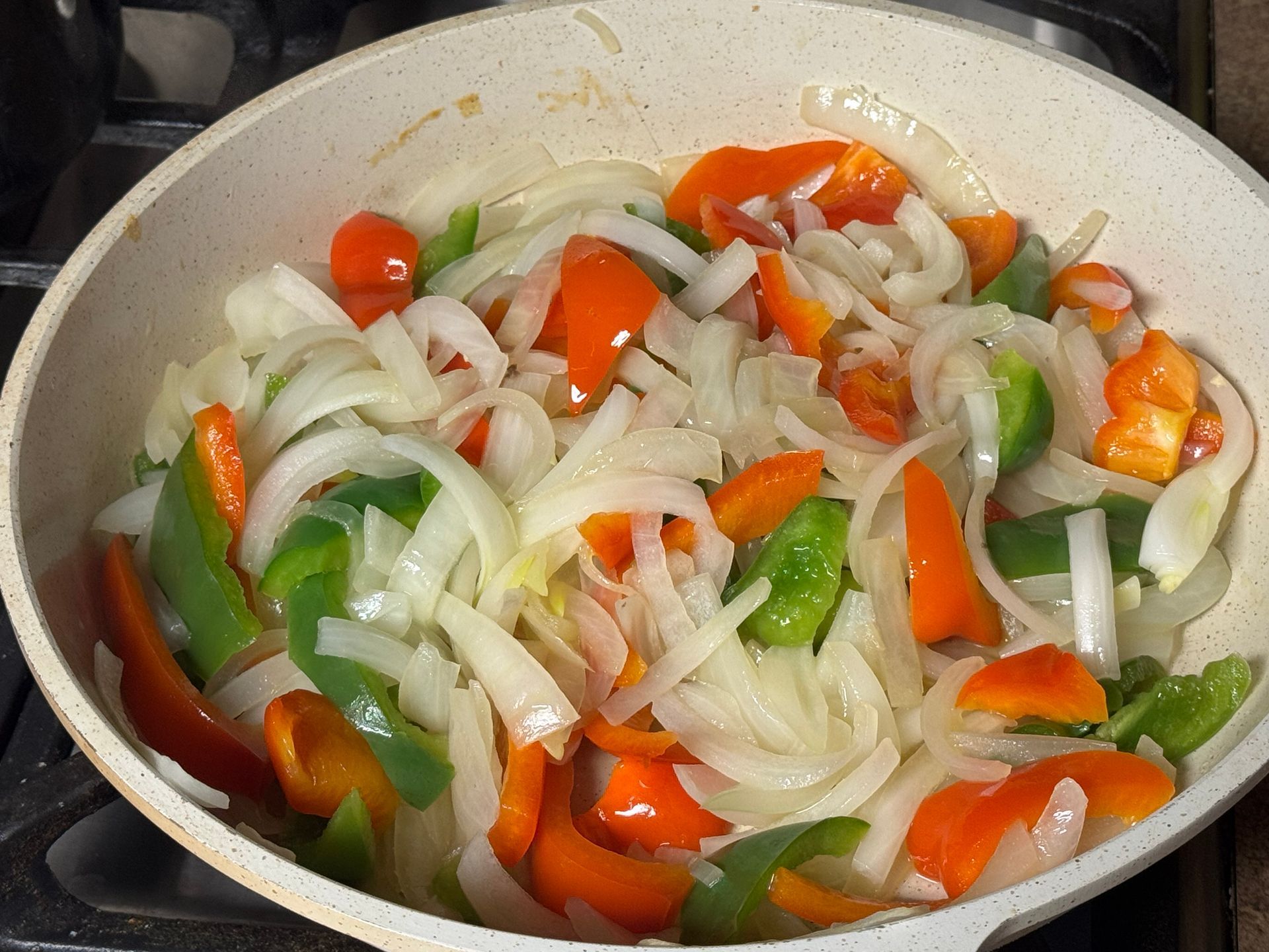 A bowl of ground chicken is sitting on a table.