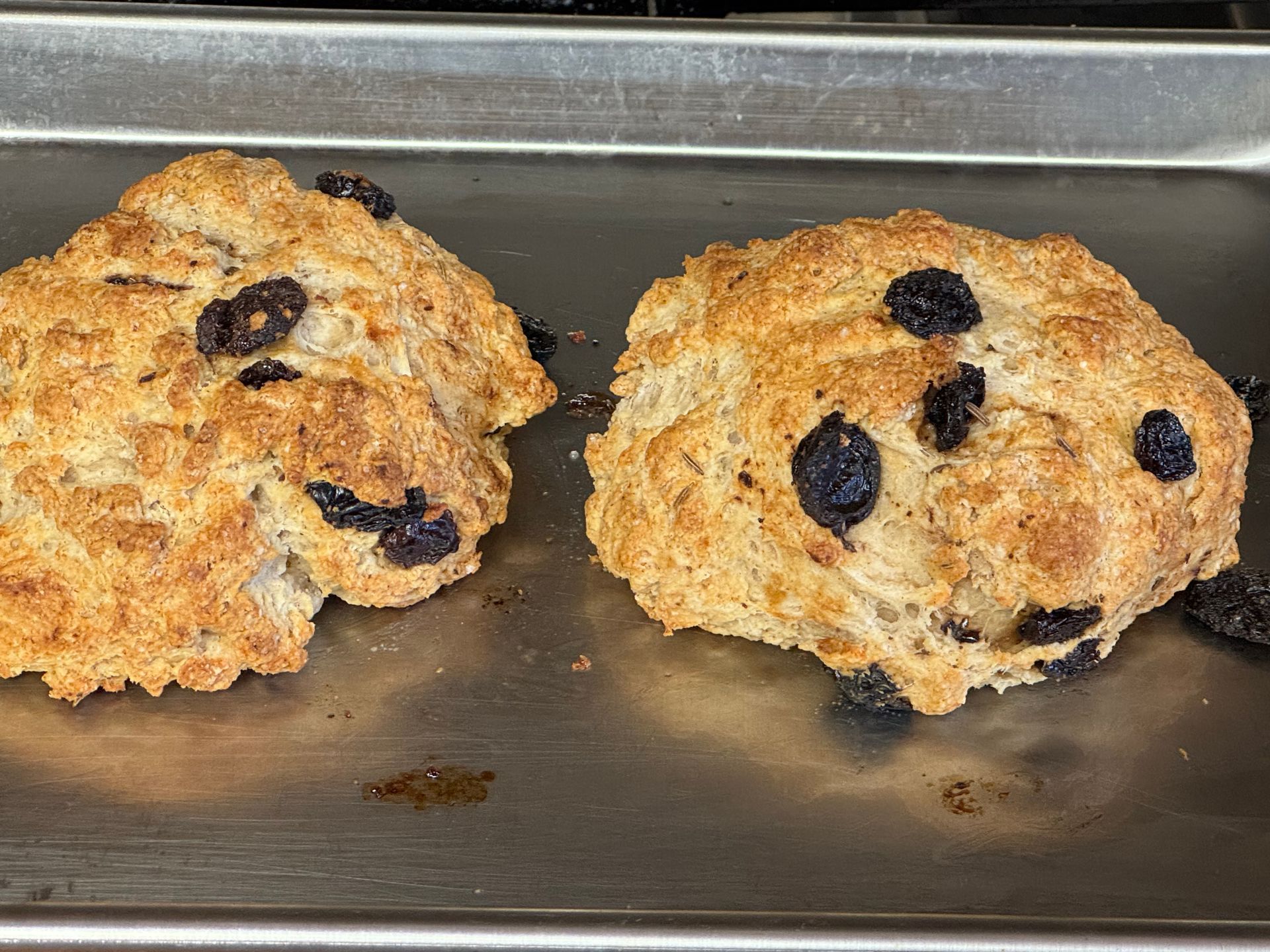 Three desserts are sitting on a table with a measuring cup in the background.