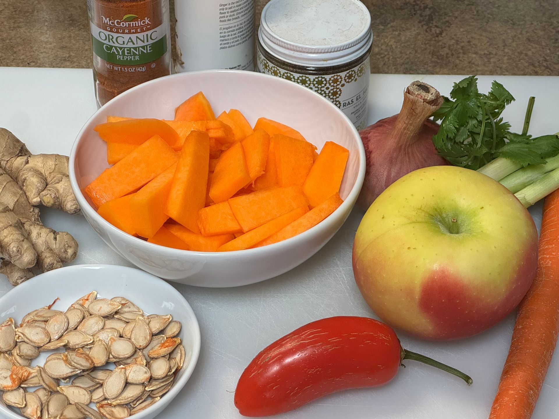 A pan filled with clams , onions , celery , and other ingredients.