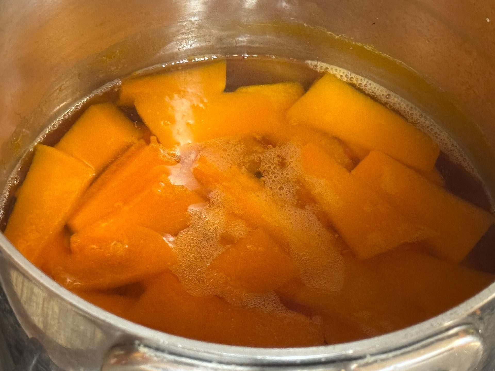Chopped celery onions and potatoes on a cutting board