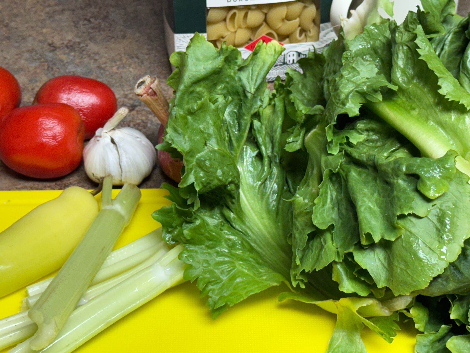 A pan filled with clams , onions , celery , and other ingredients.