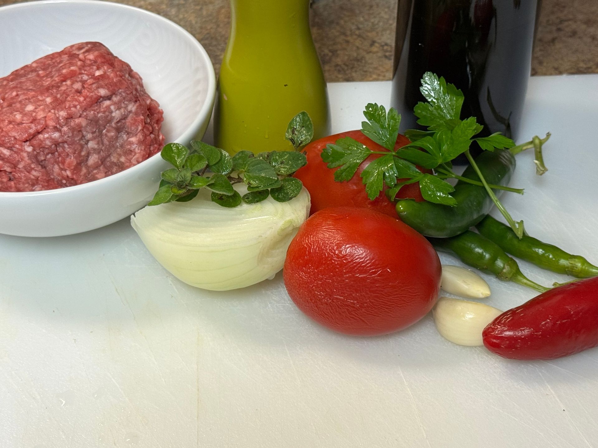 A pan filled with clams , onions , celery , and other ingredients.