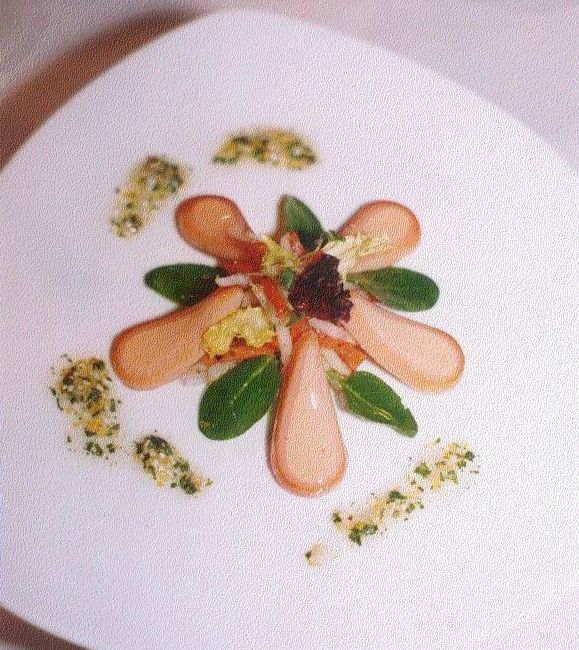 A close up of a plate of food with a flower design on it