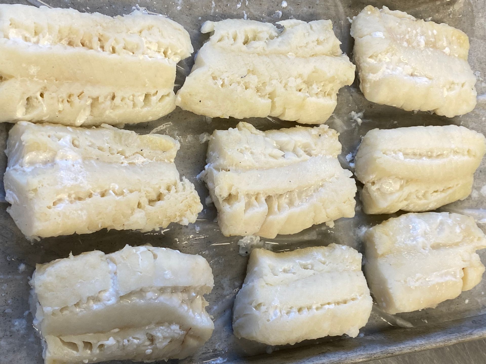 A close up of a tray of gnocchi on a table