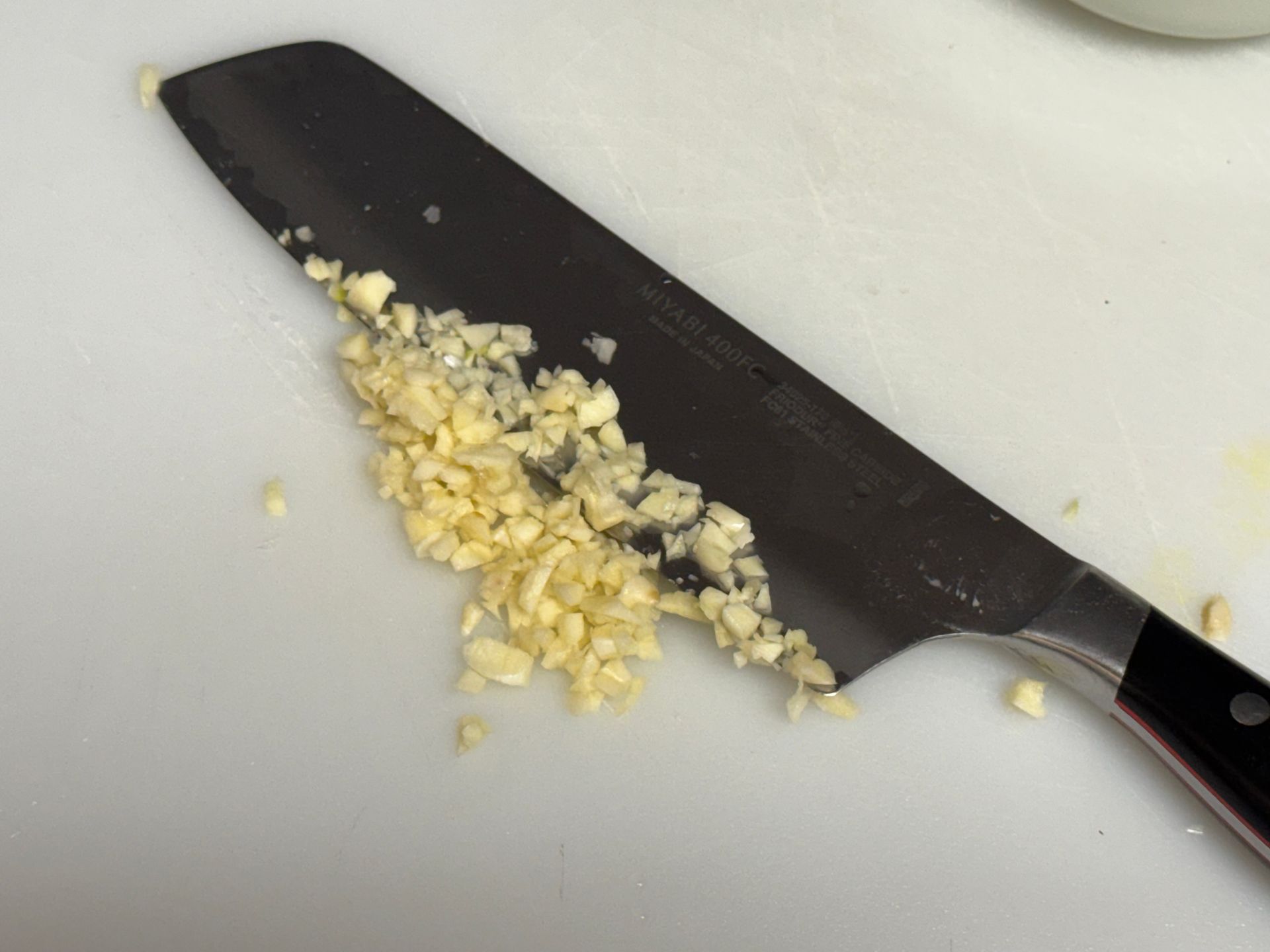 Potatoes are being cooked in a pot of water.