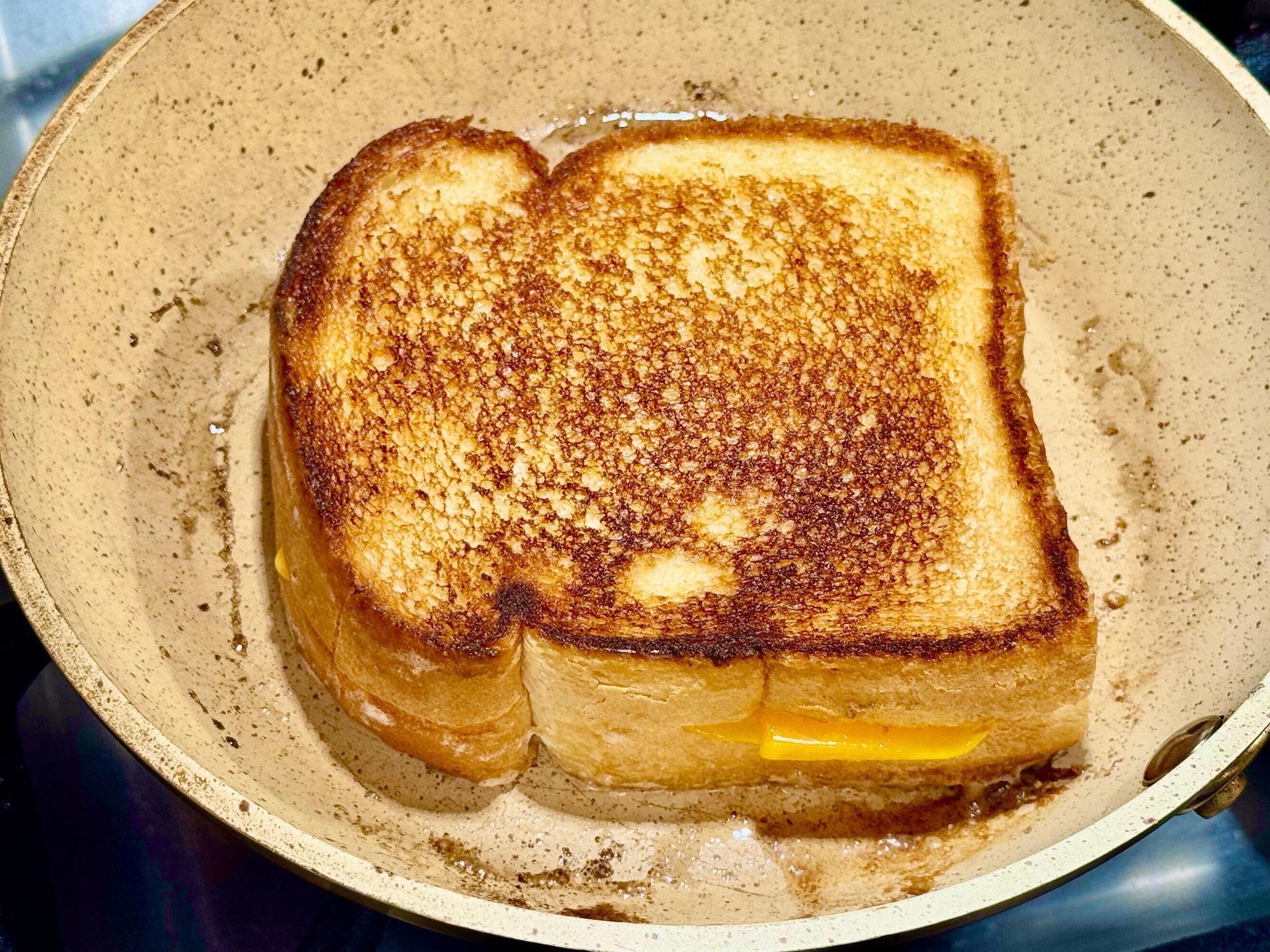 A person is rolling a burrito on a cutting board.