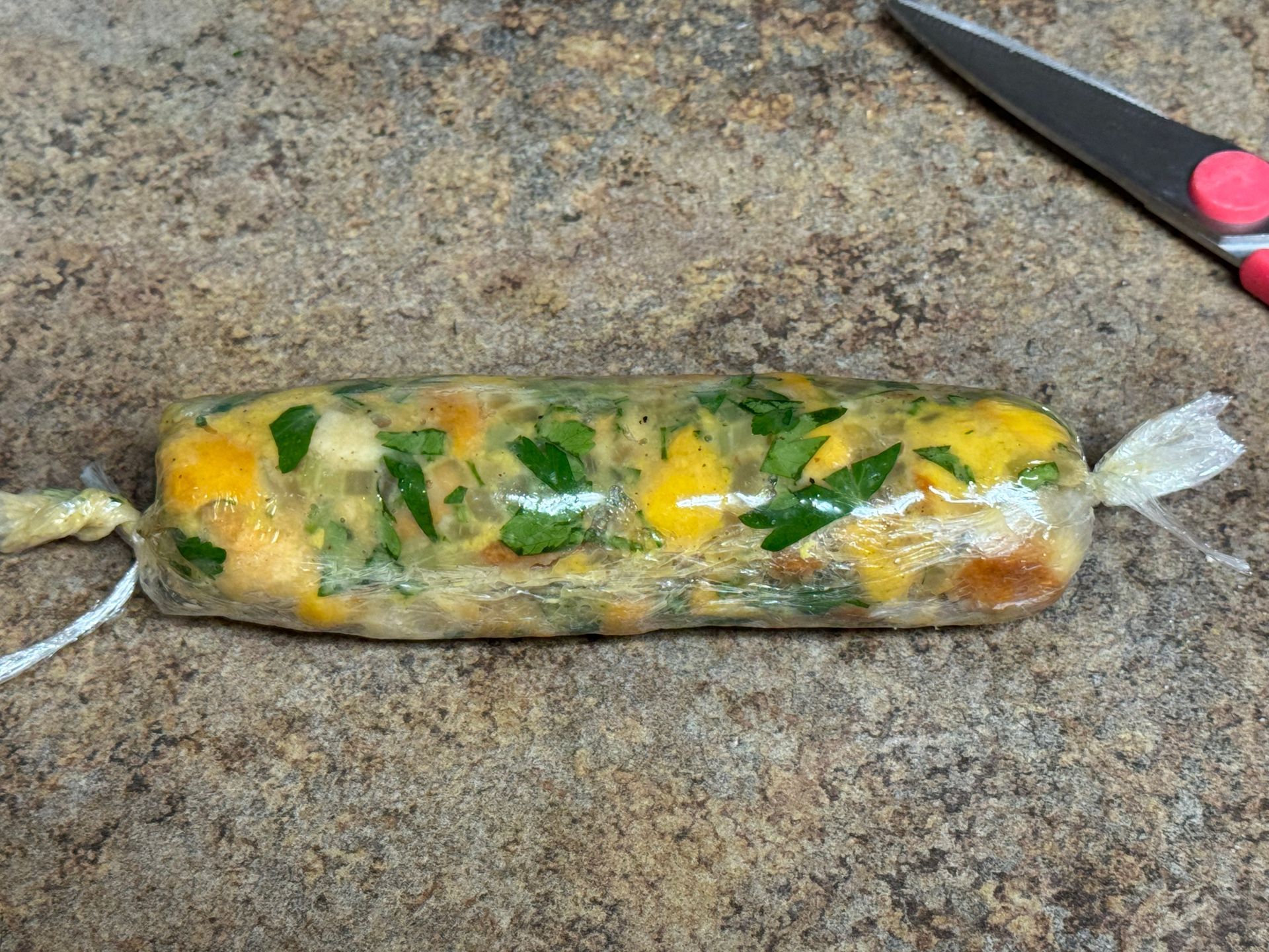 A bowl of stuffing is sitting on a table