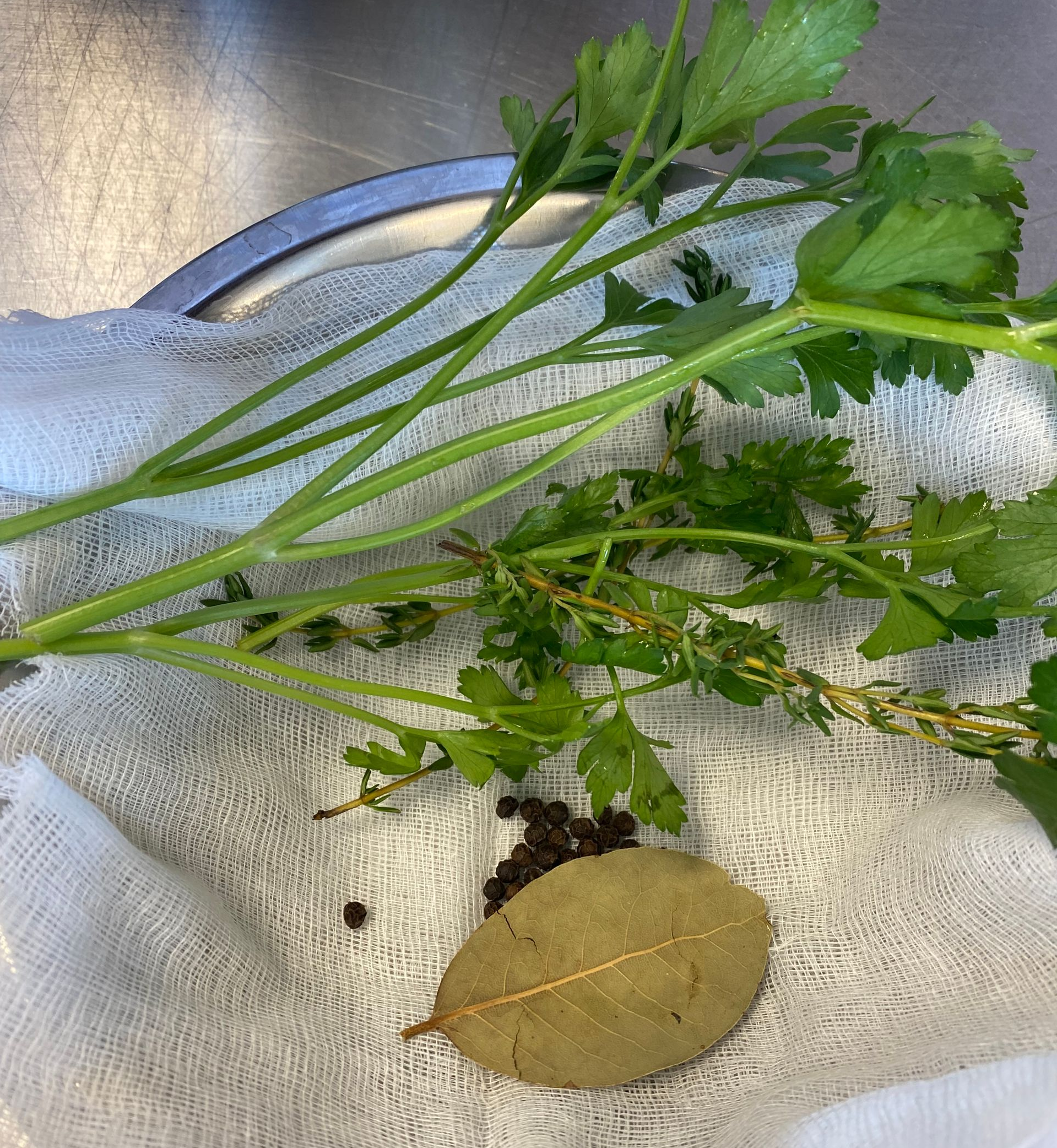 A pan filled with clams , onions , celery , and other ingredients.