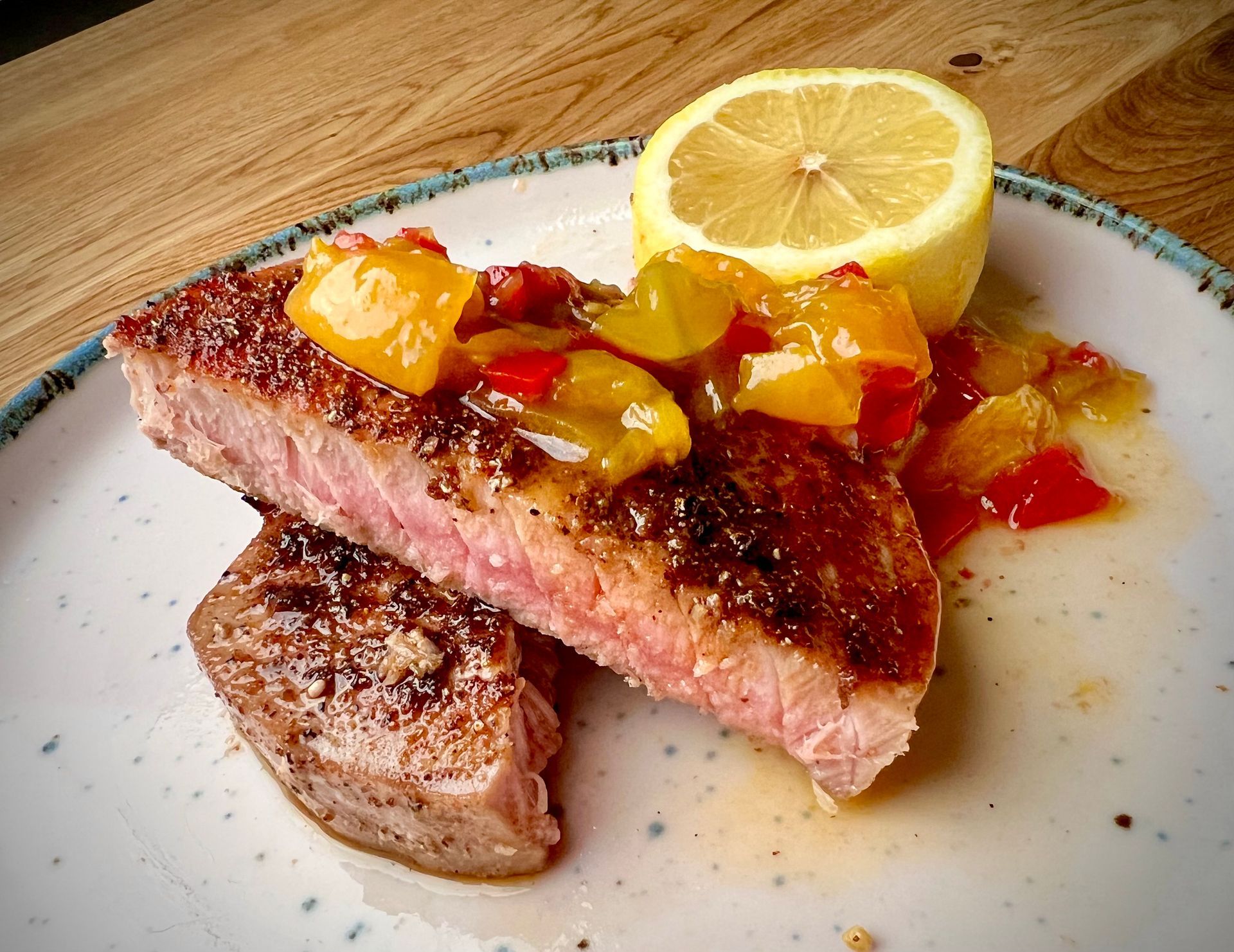 A plate of food with a slice of lemon on top