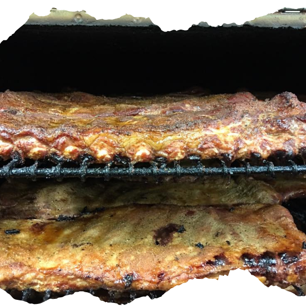 A close up of ribs cooking on a grill