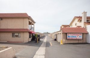 A building with a sign that says stormor self storage on it