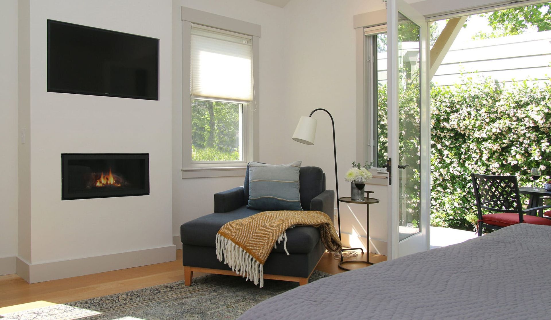 A living room with a fireplace and a flat screen tv