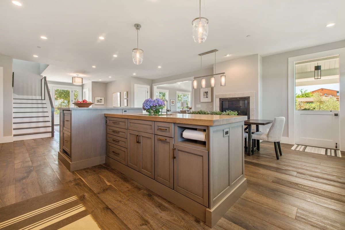 There is a large island in the middle of the kitchen.
