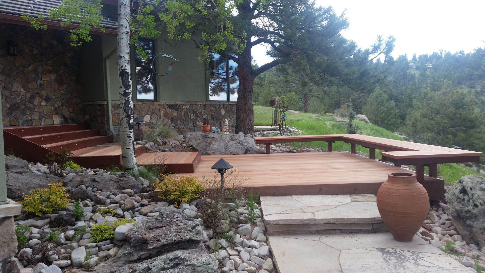 A stone building with a wooden deck in front of it