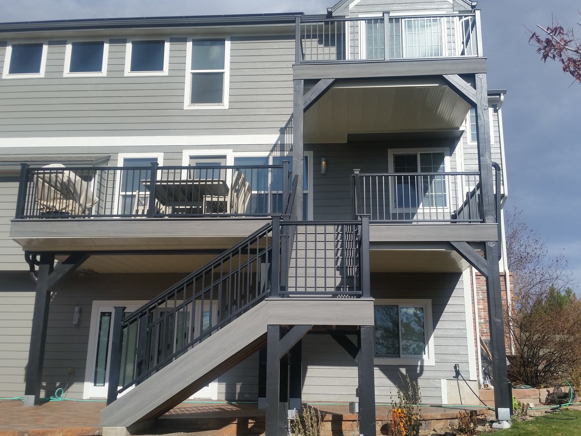 The back of a house with a deck and stairs
