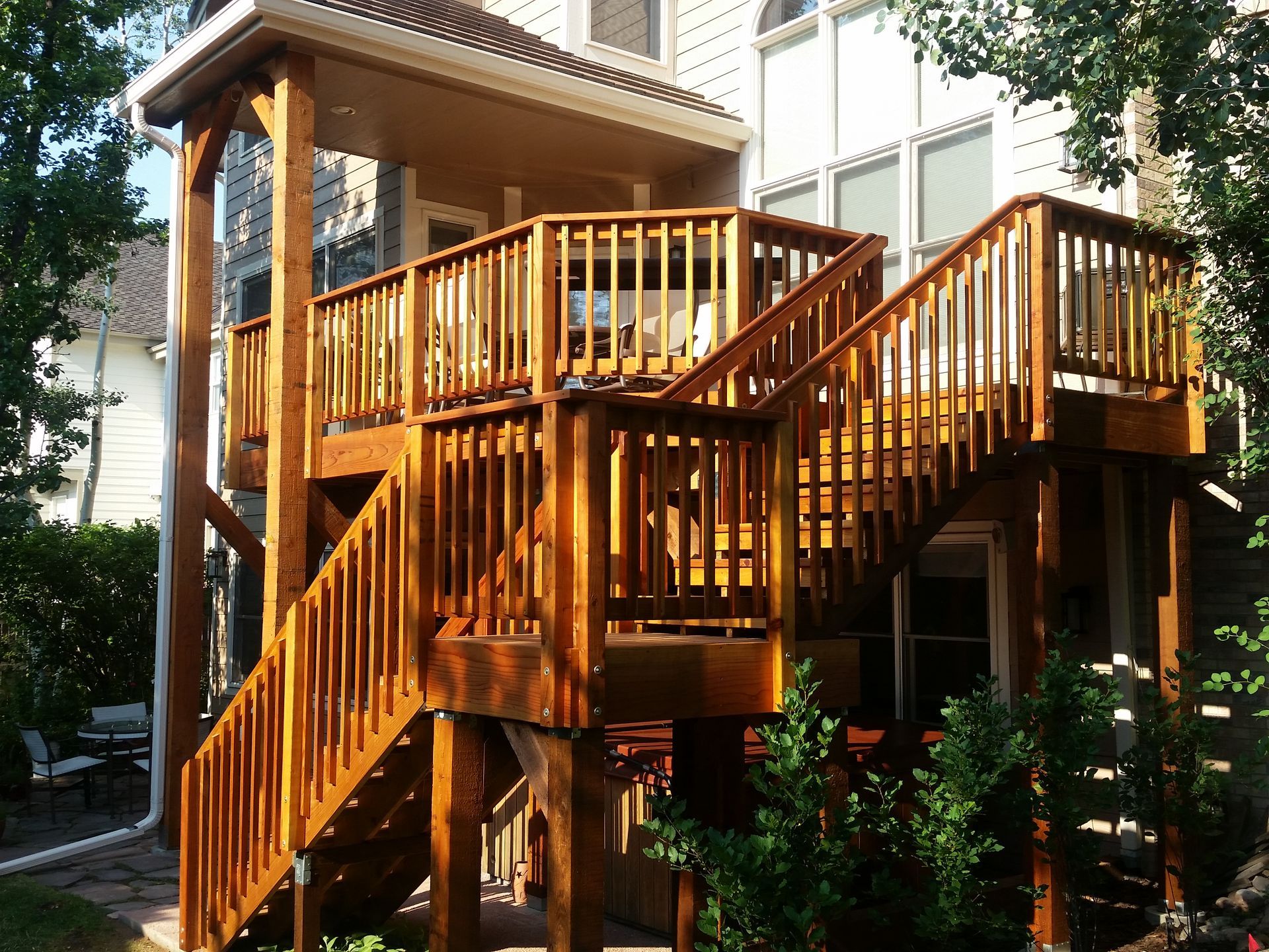 A wooden deck with stairs leading up to it