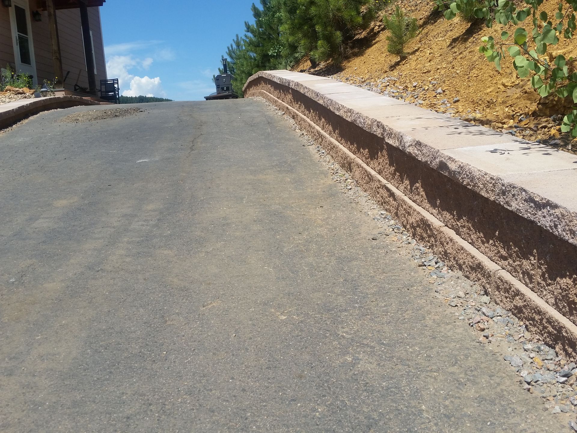 A road with a concrete curb on the side of it