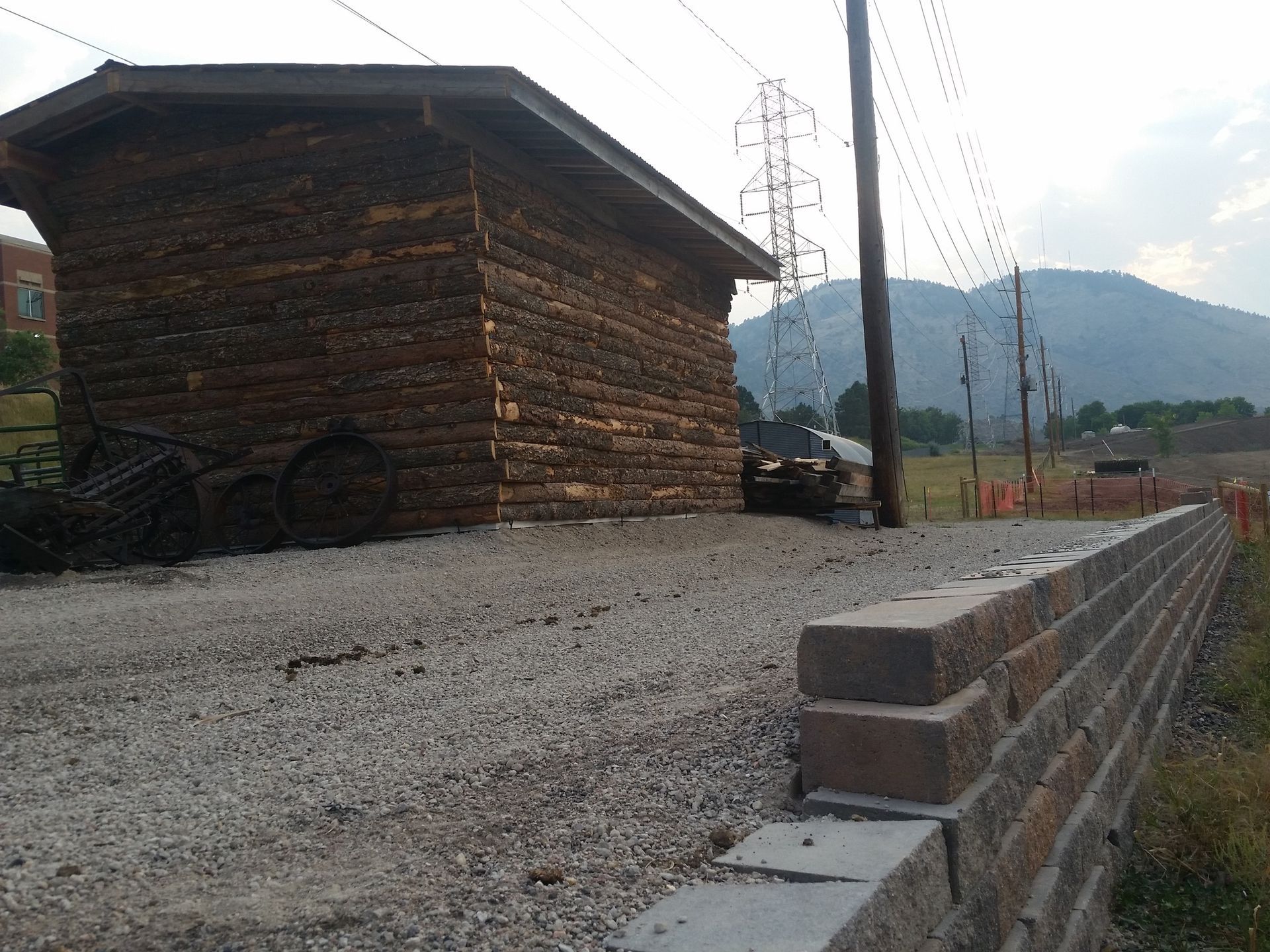 A small brick building with a car parked in front of it