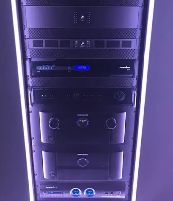 A server rack with a purple light behind it