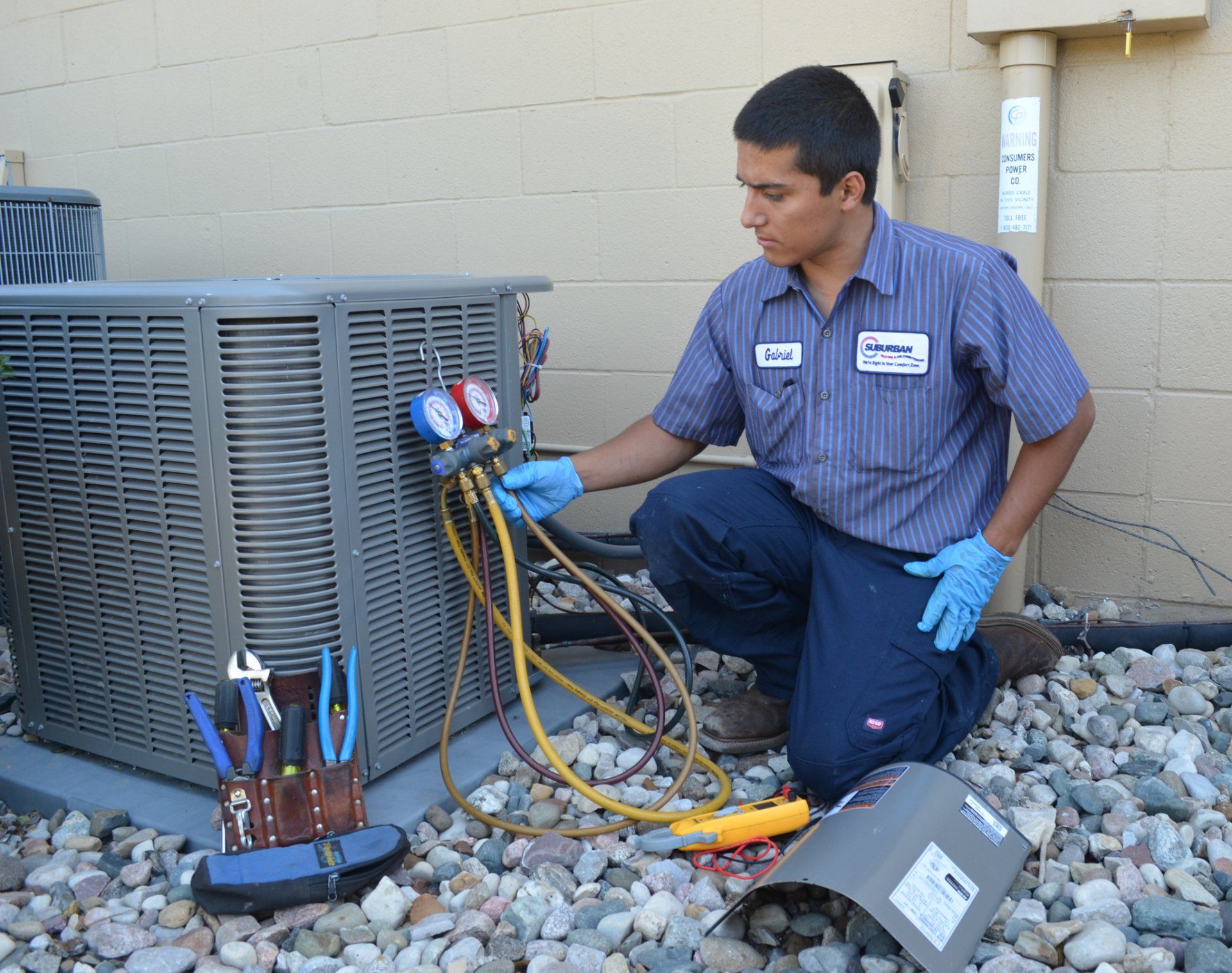 Workman Servicing Air Conditioning — Kalamazoo, MI — Suburban Heating & Air Conditioning
