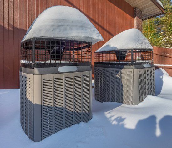 Two Heat Pumps in Winter — Kalamazoo, MI — Suburban Heating & Air Conditioning