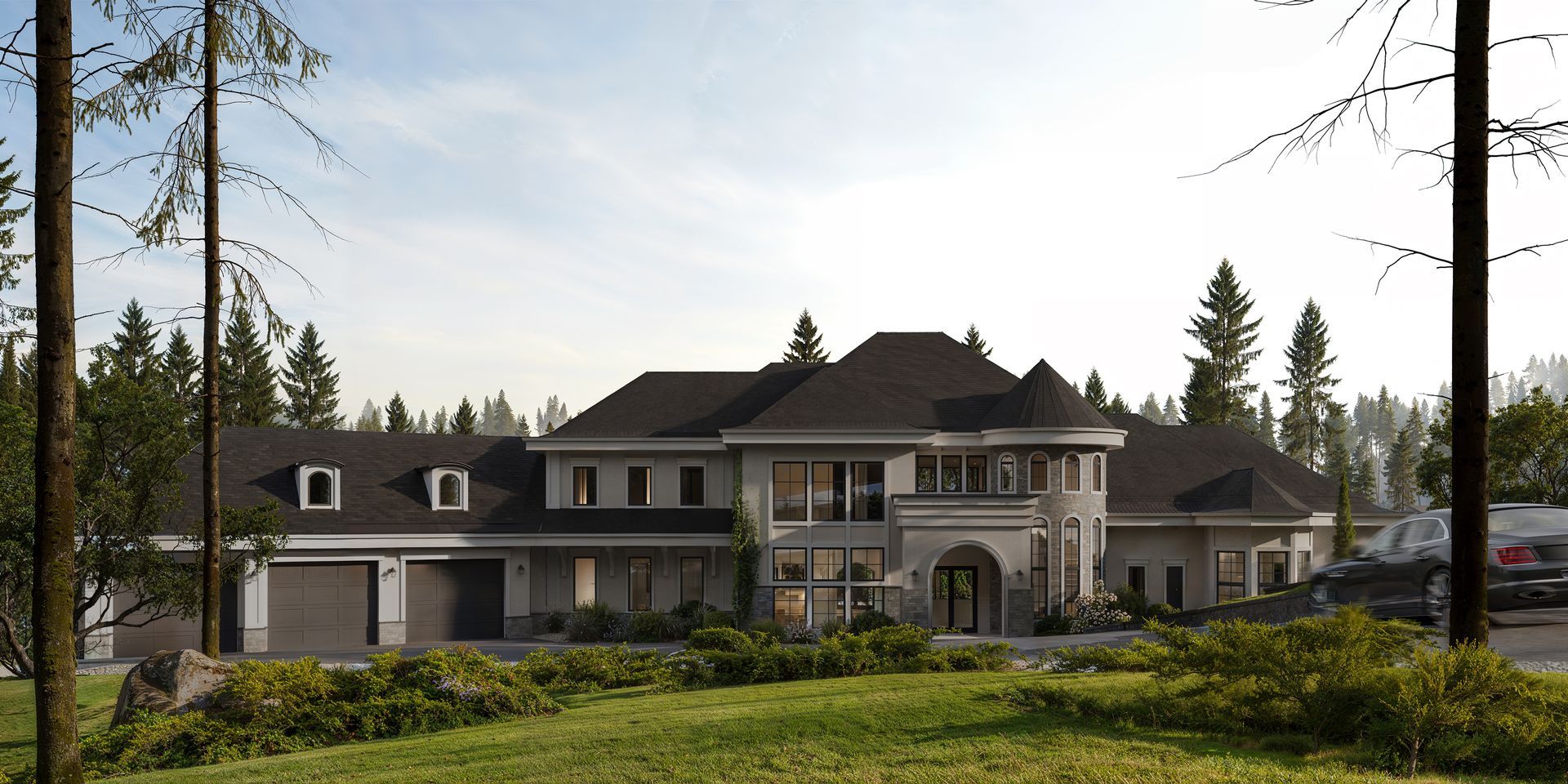 A large, multistory estate with a garage and gray siding, surrounded by a forest under a clear, bright sky.