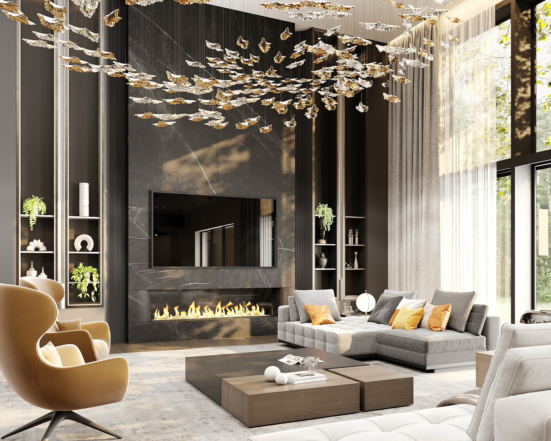 A luxurious living room featuring a large black marble fireplace, a modern gray sectional, and a gold leaf chandelier.