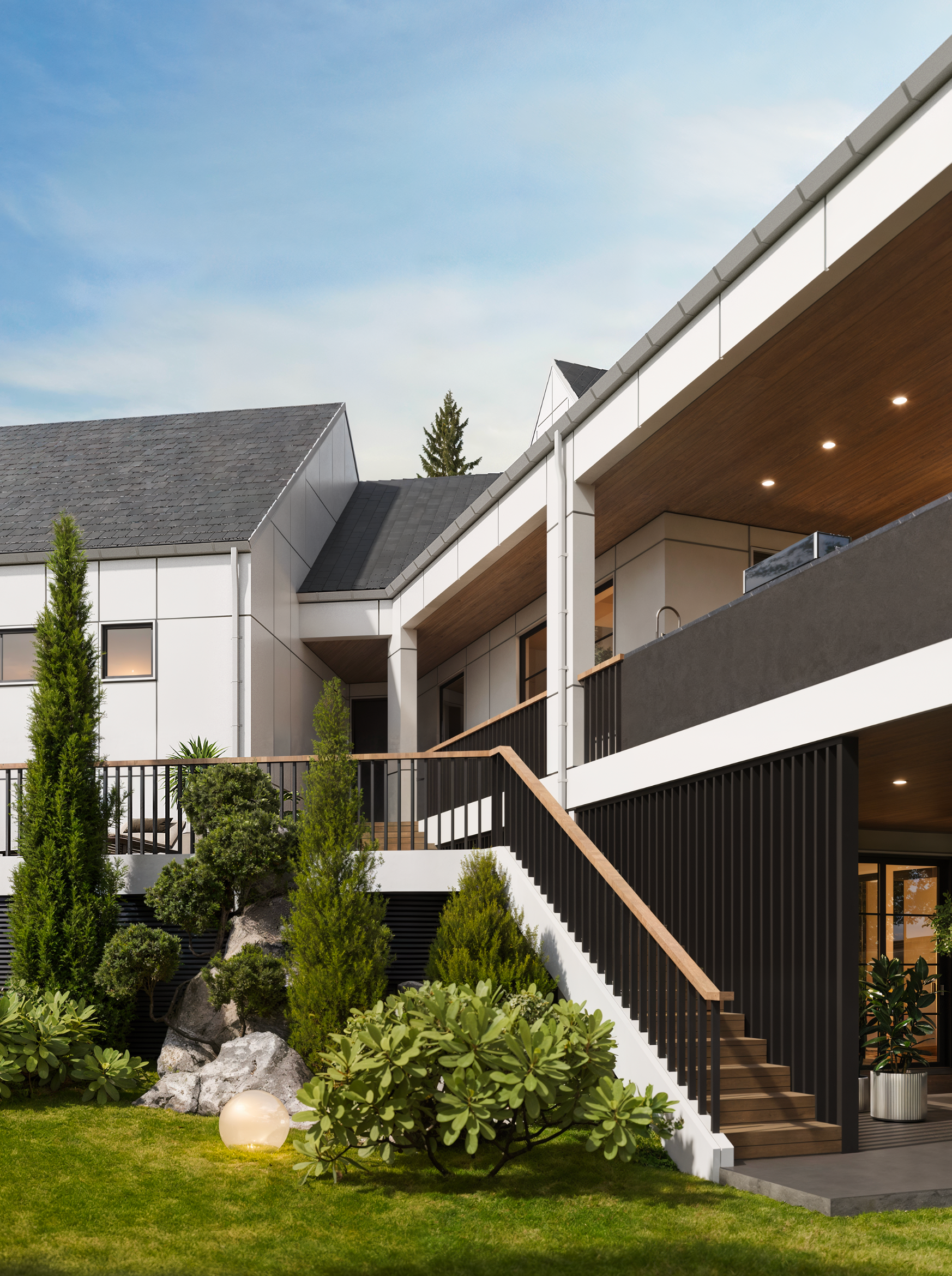 Modern white multi-story house with a balcony, wooden stairs, and landscaped garden under a clear blue sky.