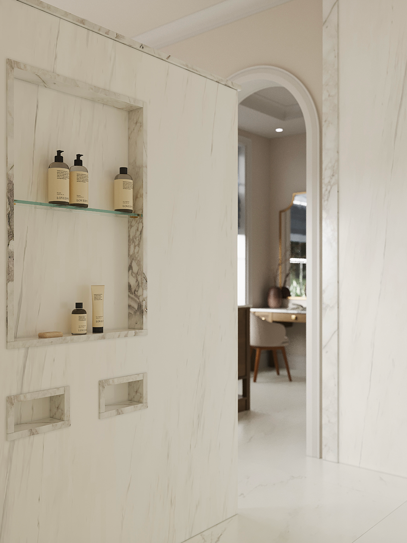 A marble shower wall with recessed shelving for toiletries, with a view through an arched doorway into a room.