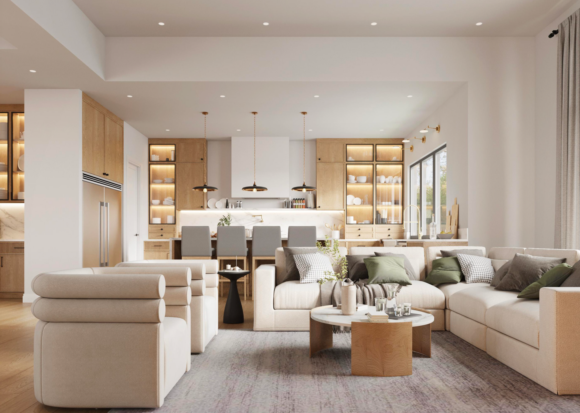 A bright, modern open-plan kitchen and living room featuring a neutral sofa, area rug, and wood-toned cabinetry.