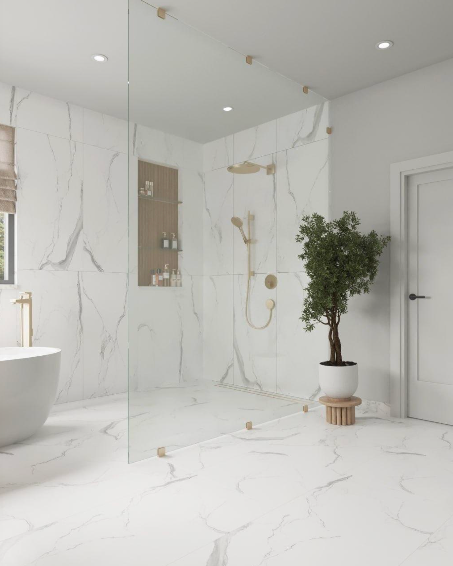 A modern bathroom with white marble walls and flooring, a glass shower partition, a freestanding tub, and a potted plant.