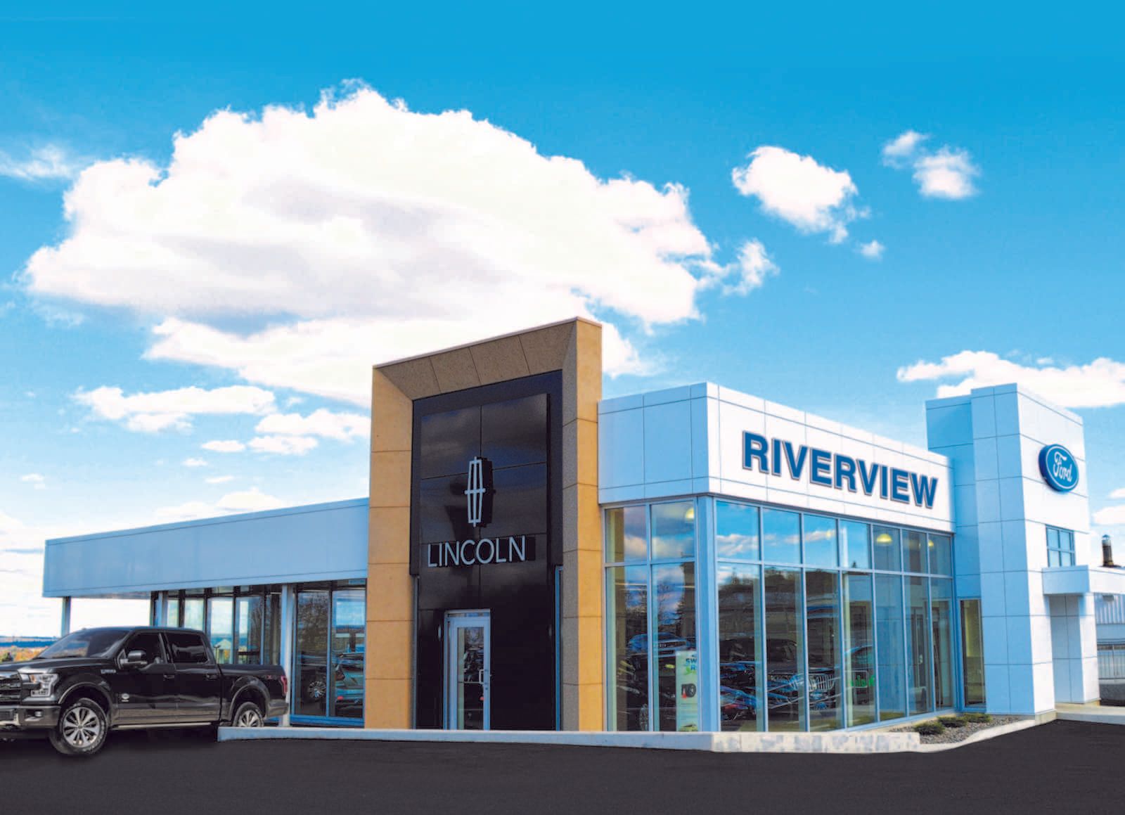 A lincoln dealership with a car parked in front of it